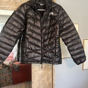 Woman’s North Face down jacket.